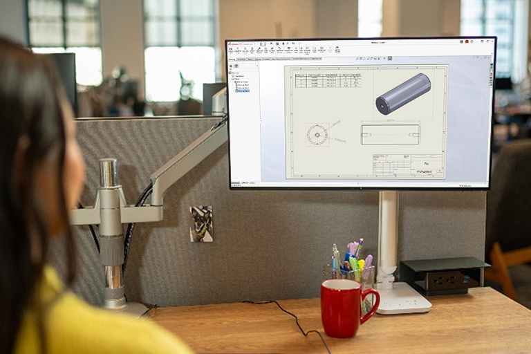 Person looking at SOLIDWORKS 3D CAD model on a monitor screen