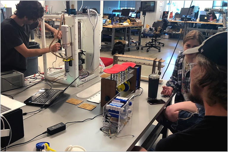 Makers working in the SOLIDWORKS Fab Lab maker space