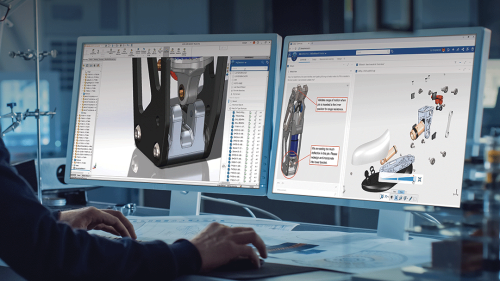 3DEXPERIENCE SOLIDWORKS for Education man at two monitors with 3D renderings