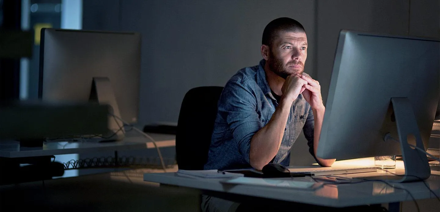 Man looking at screen and thinking - SOLIDWORKS