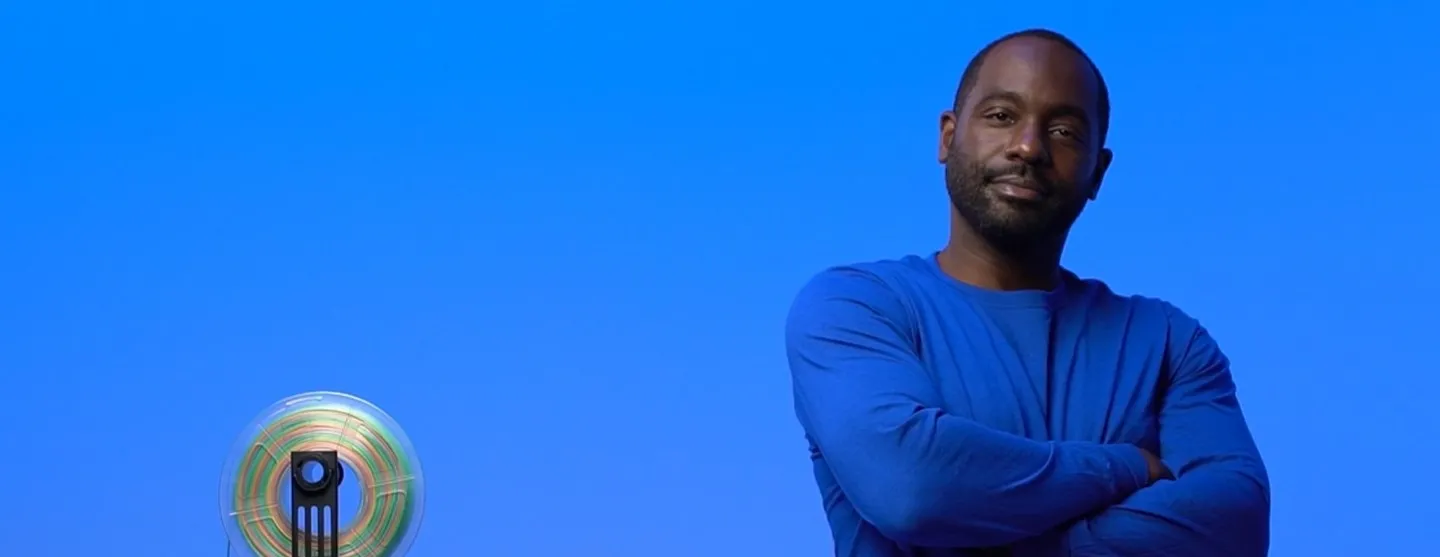 Maker standing next to 3D printing material - SOLIDWORKS